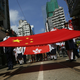Participants hold a Chinese national flag and a Hong Kong flag as tens of thousands of people march on a down town street to oppose a planned civil disobedience campaign by pro-democracy activists in Hong Kong, Sunday, Aug. 17, 2014. The rally was organized by a pro-Beijing group. Many carried banners or shouted slogans saying they were opposed to the Occupy Central pro-democracy movement